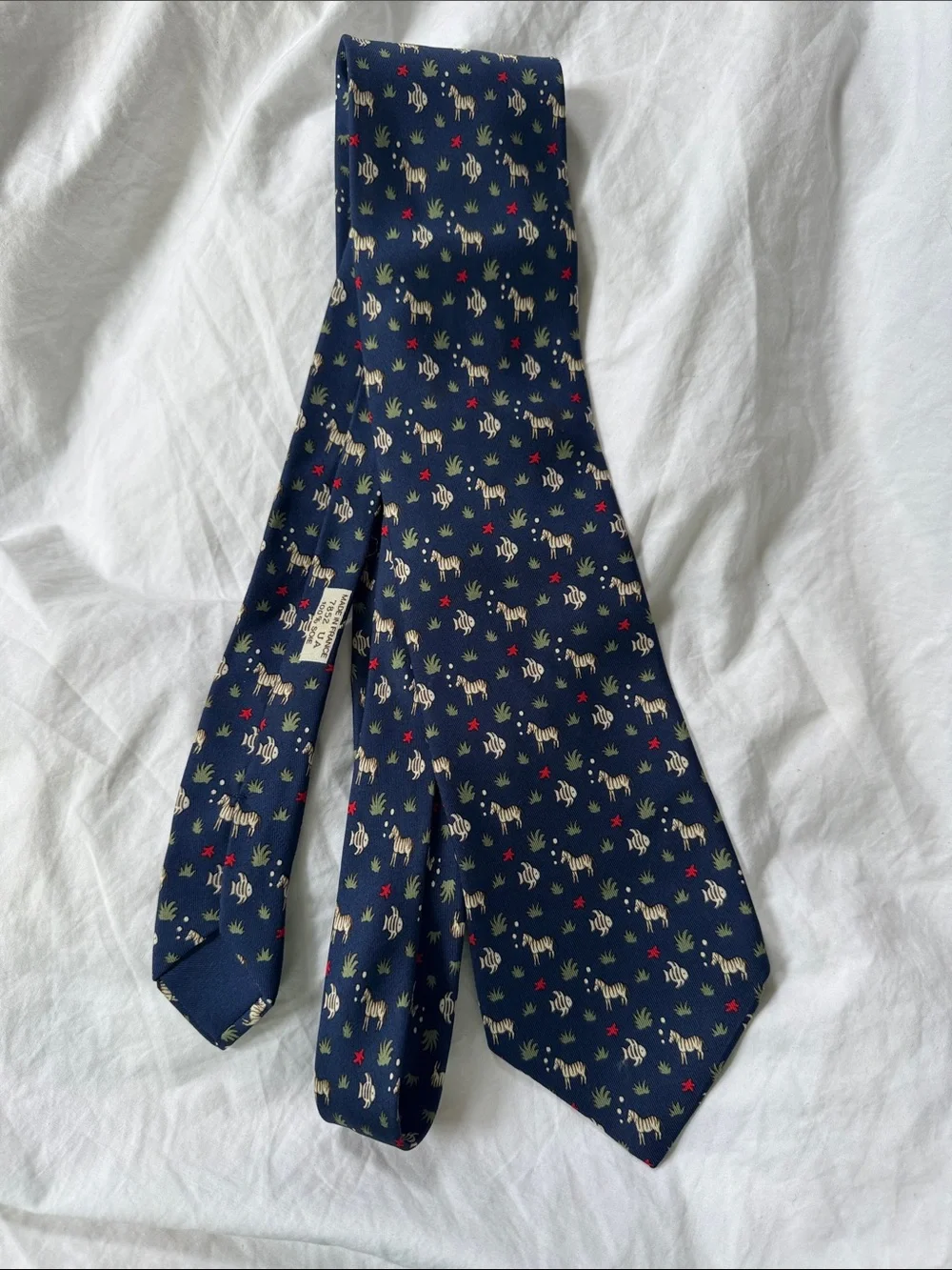 Hermès, navy silk necktie with fish and zebras and starfish MINT